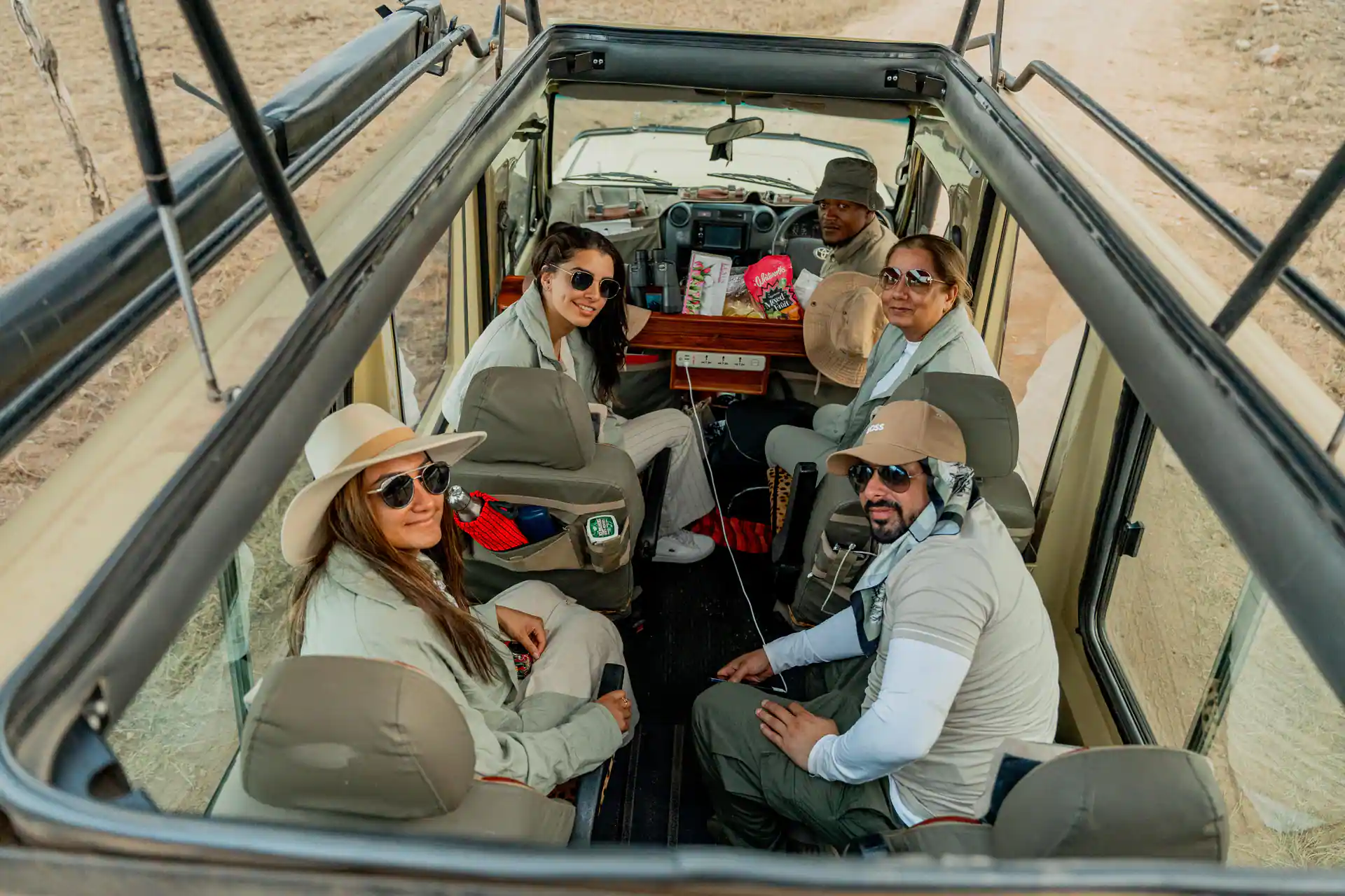 Family enjoying a safari game drive in Tanzania
